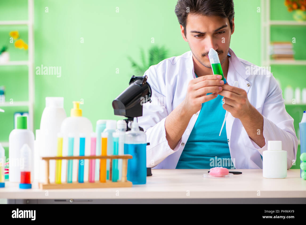 Chemist testing soap in the lab Stock Photo - Alamy