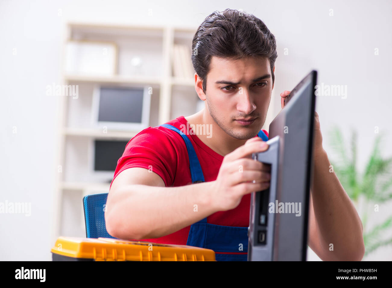 Professional repair engineer repairing broken tv Stock Photo Alamy
