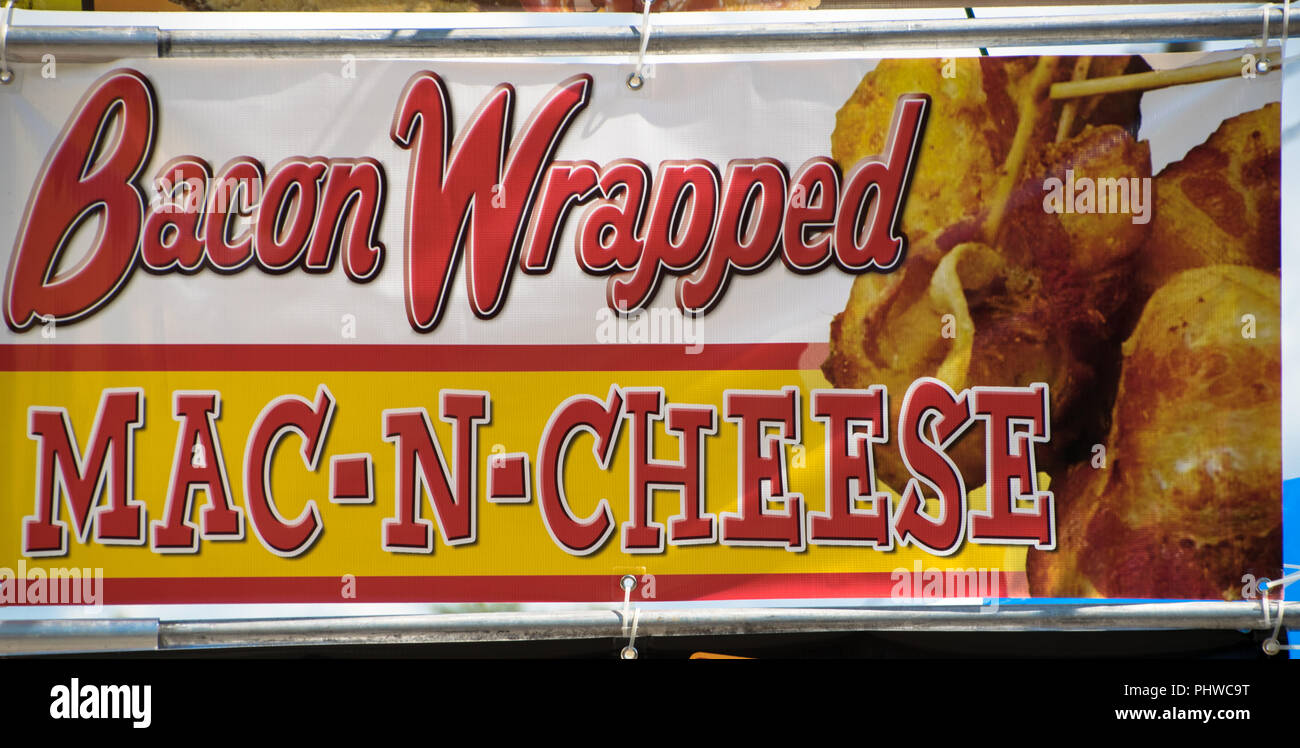 Bacon wrapped Mac-n-cheese sign at the Matthews Alive street fair on Labor Day Weekend in Matthews, North Carolina USA Stock Photo