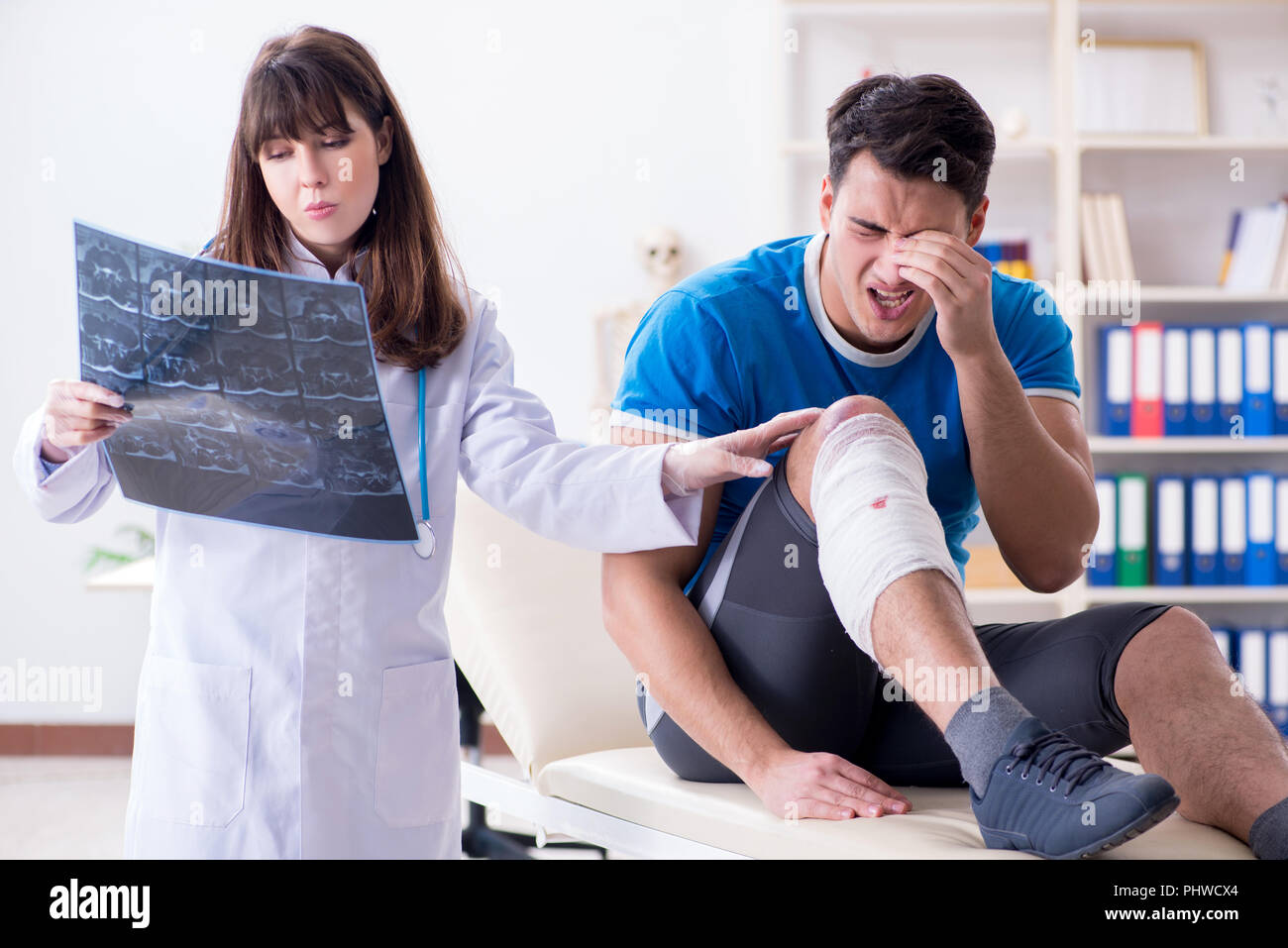 Sports player visiting doctor after injury Stock Photo Alamy