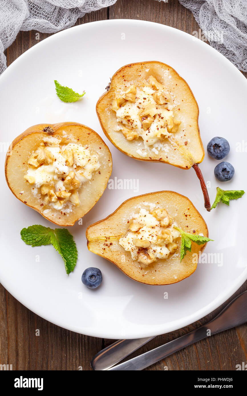 Pear with ricotta cheese, honey and cinnamon Stock Photo Alamy