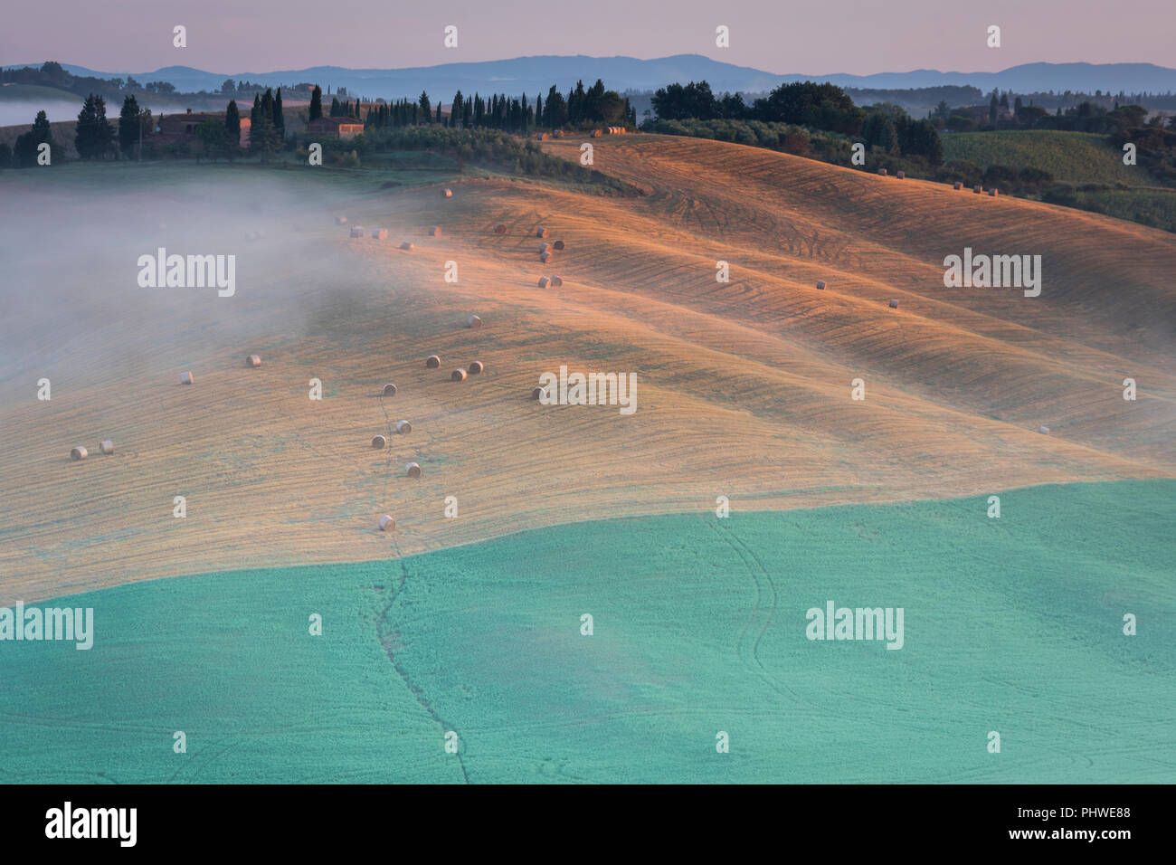 A view of farmlands and rolling hills near Buonconvento, Tuscany, Italy. Stock Photo