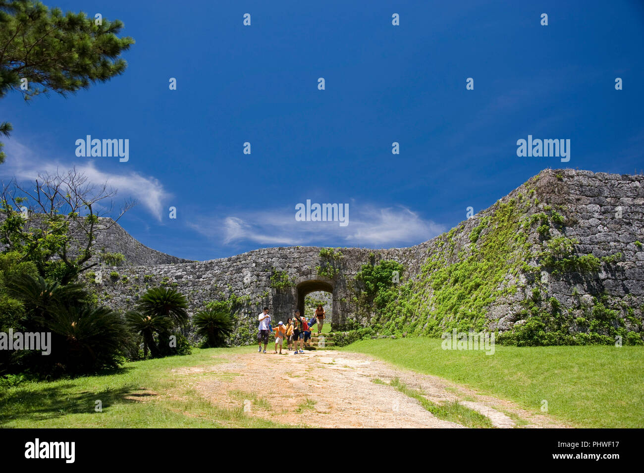 Visitors exit the main gate at Zakimi Castle ruins in Yomitan VILLAGE, Okinawa Prefecture, Japan, on May 20, 2012. Built between 1416 and 1422 by the  Stock Photo