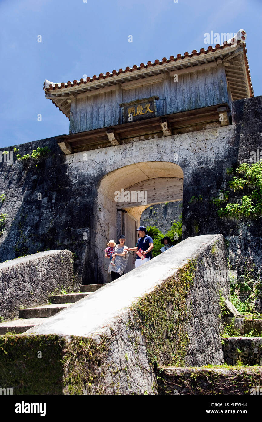 Visitors walk through the Kyukeimon gate which is located  inside the Shuri-jo Castle Park in Naha, Okinawa Prefecture, Japan, on June 25, 2012. The a Stock Photo