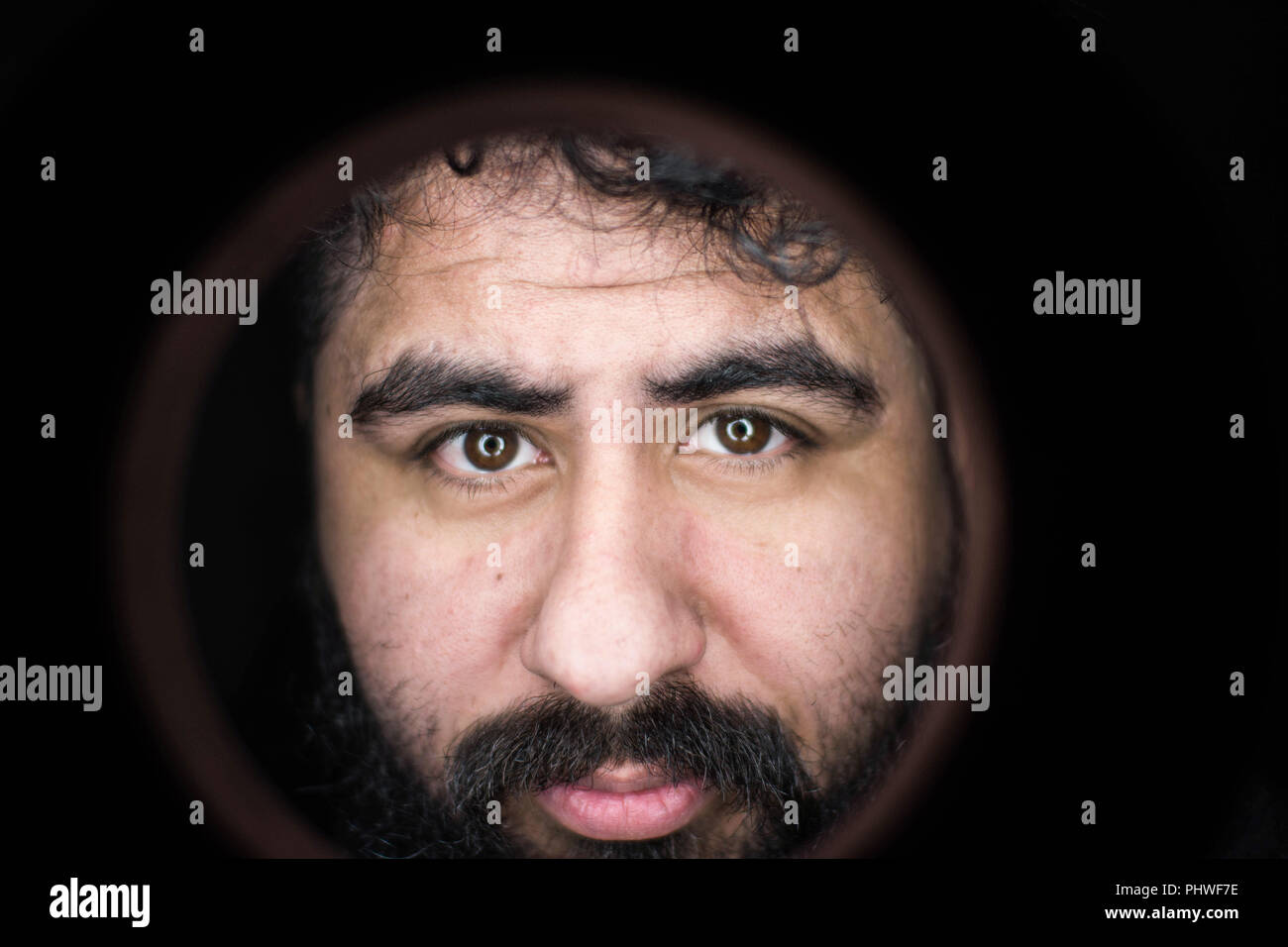 Portrait of hispanic man looking at the camera Stock Photo