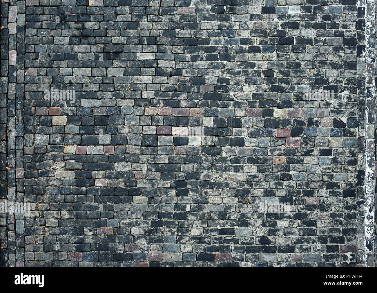 old cobblestone road for background or texture Stock Photo - Alamy