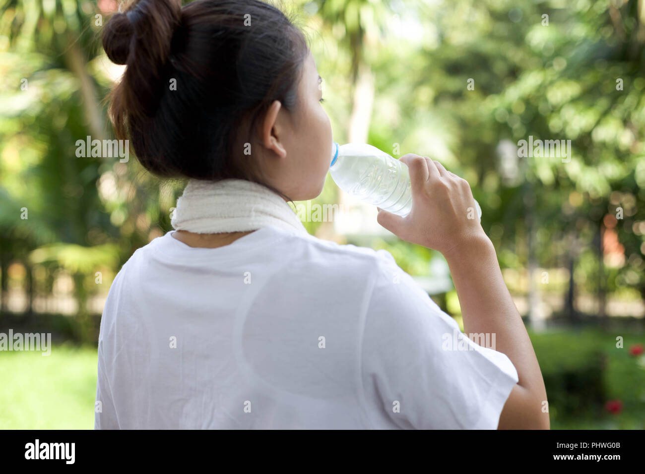 Young girl drinking water after working out Stock Photo Alamy