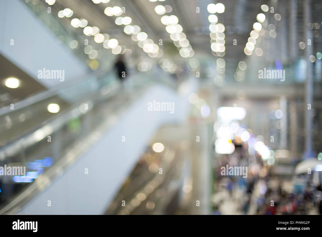 Cocept people on escalator at the airport in blured background Stock Photo