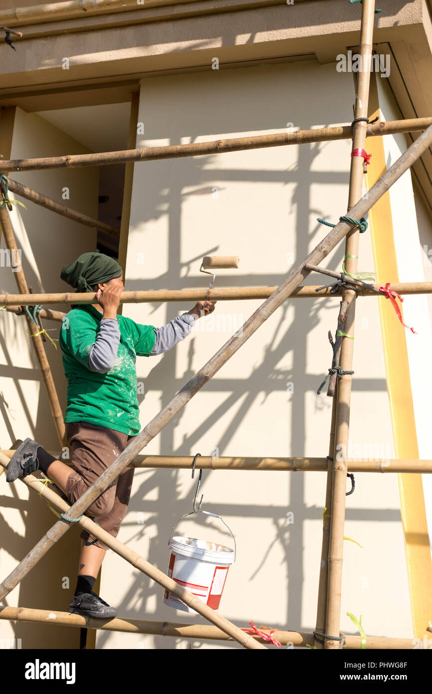 Person painting apartment exterior hi-res stock photography and images
