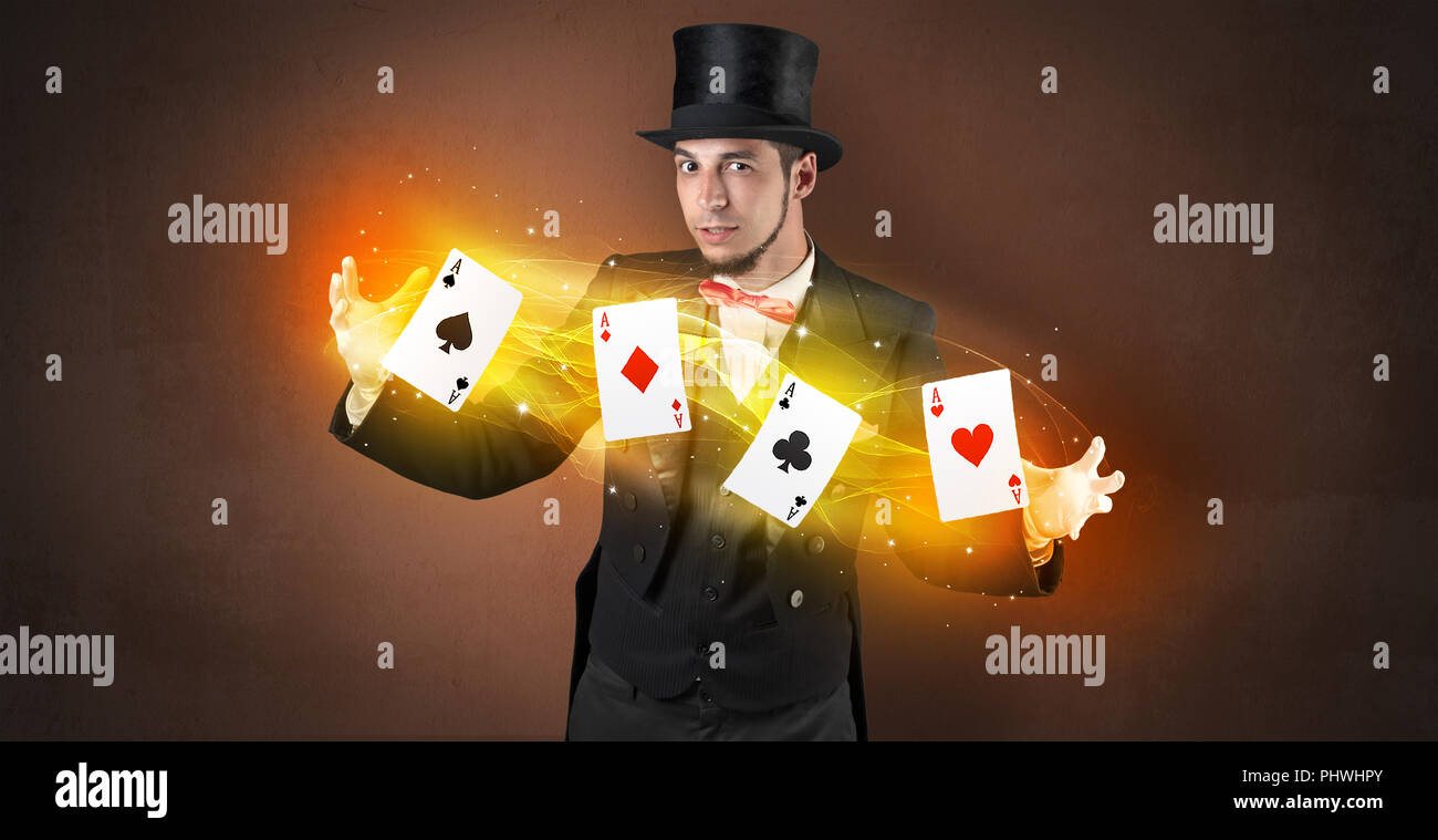 Illusionist in tails bandy play cards between his two hands Stock Photo ...