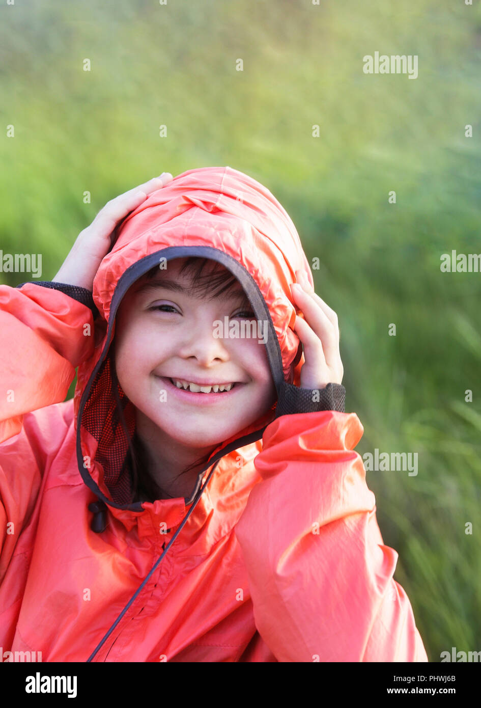 Portrait of little girl smiling outside Stock Photo - Alamy