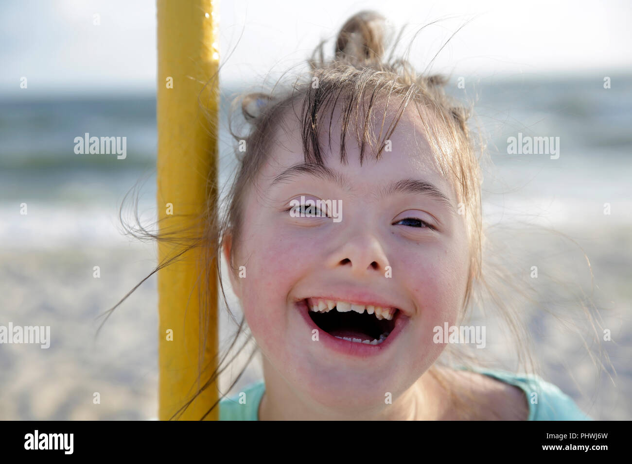 Portrait of down syndrome girl smiling Stock Photo