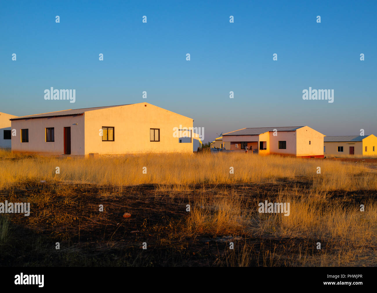 Popular and middle class new houses in the bush, Cunene Province, Oncocua, Angola Stock Photo
