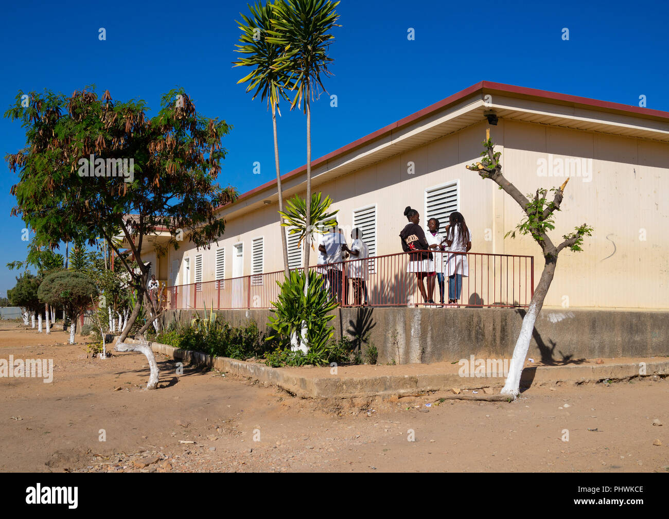 Teenagers in front of a school building, Huila Province, Lubango, Angola Stock Photo