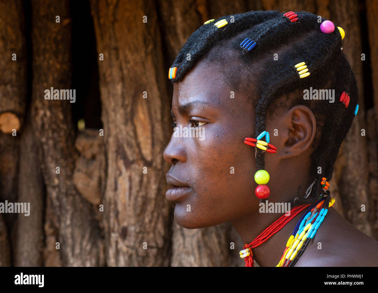 Portrait of a Mudimba tribe woman wearing a bra, Cunene Province