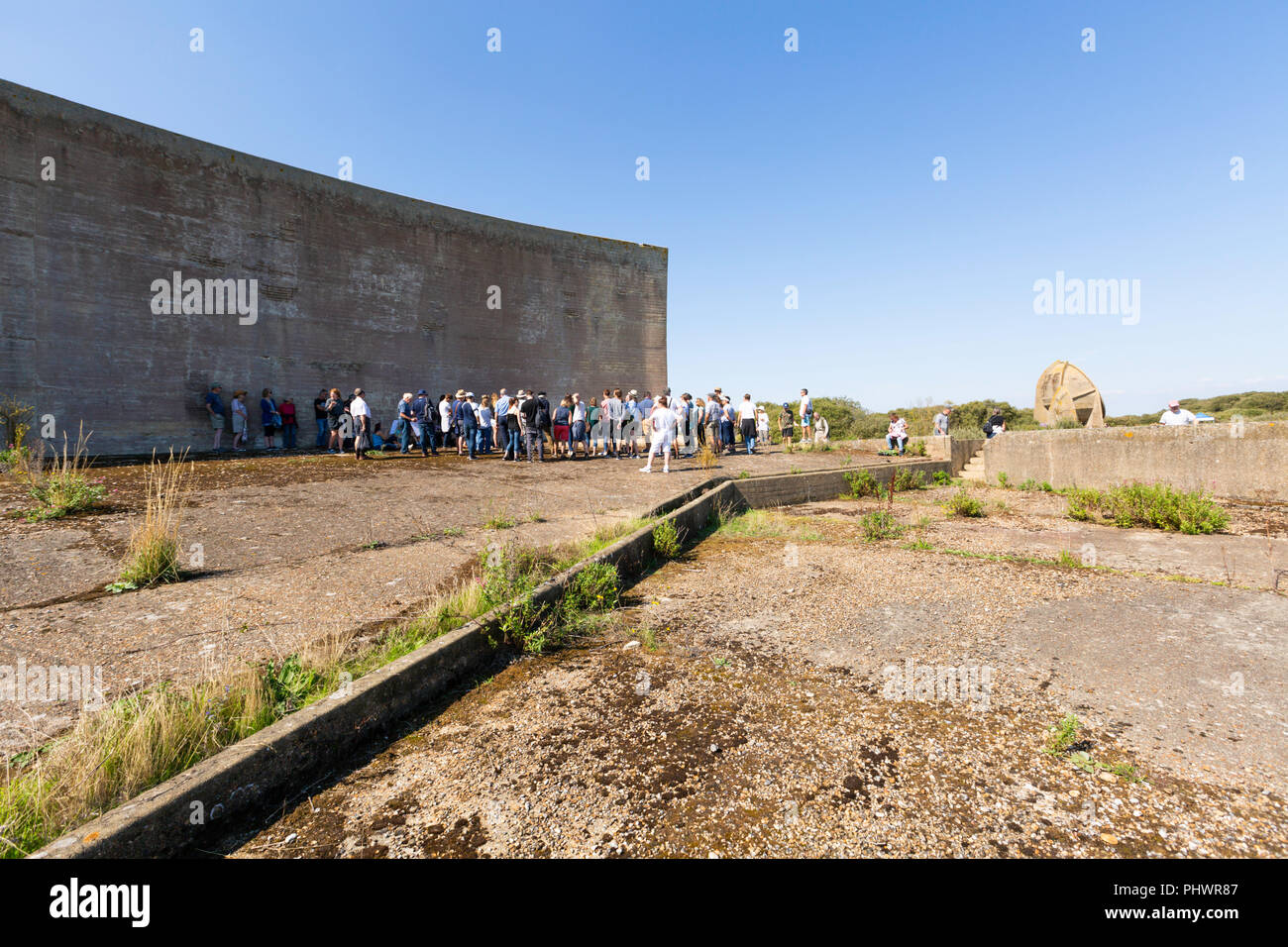 Open Day at the Sound Mirrors, Lade Pits RSPB reserve, Romney Marsh. Kent. Visitors are standing in front of the 200' Sound Mirror. Stock Photo