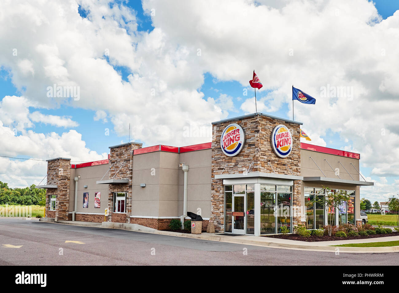 Front exterior entrance of Burger King fast food restaurant showing the drive thru or through lane in Montgomery Alabama, USA. Stock Photo