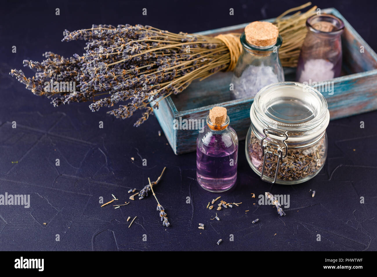 Essential lavender oil and dry lavender flowers Stock Photo Alamy