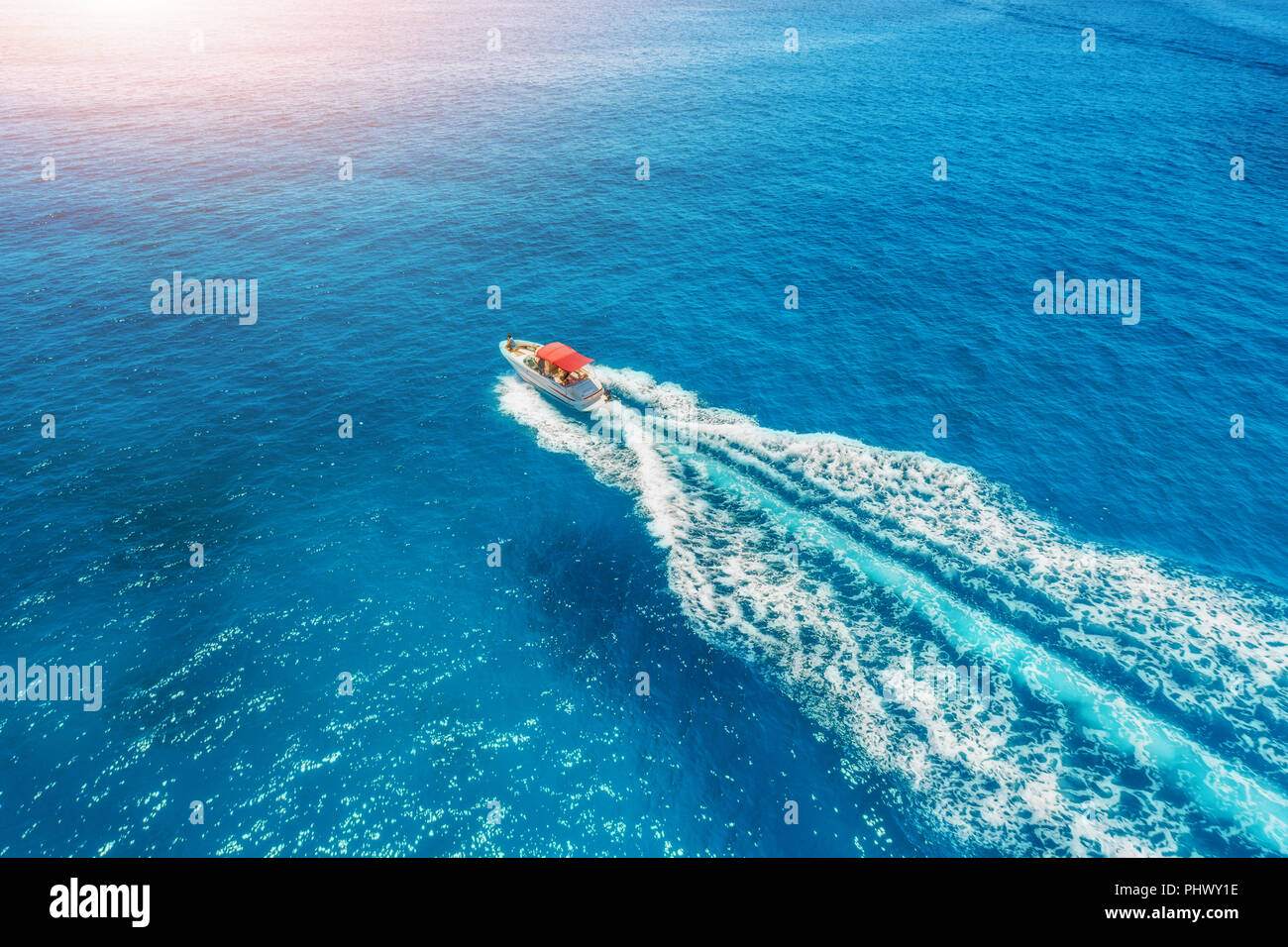 Motorboat at the sea in balearic islands at sunset. Aerial view of ...