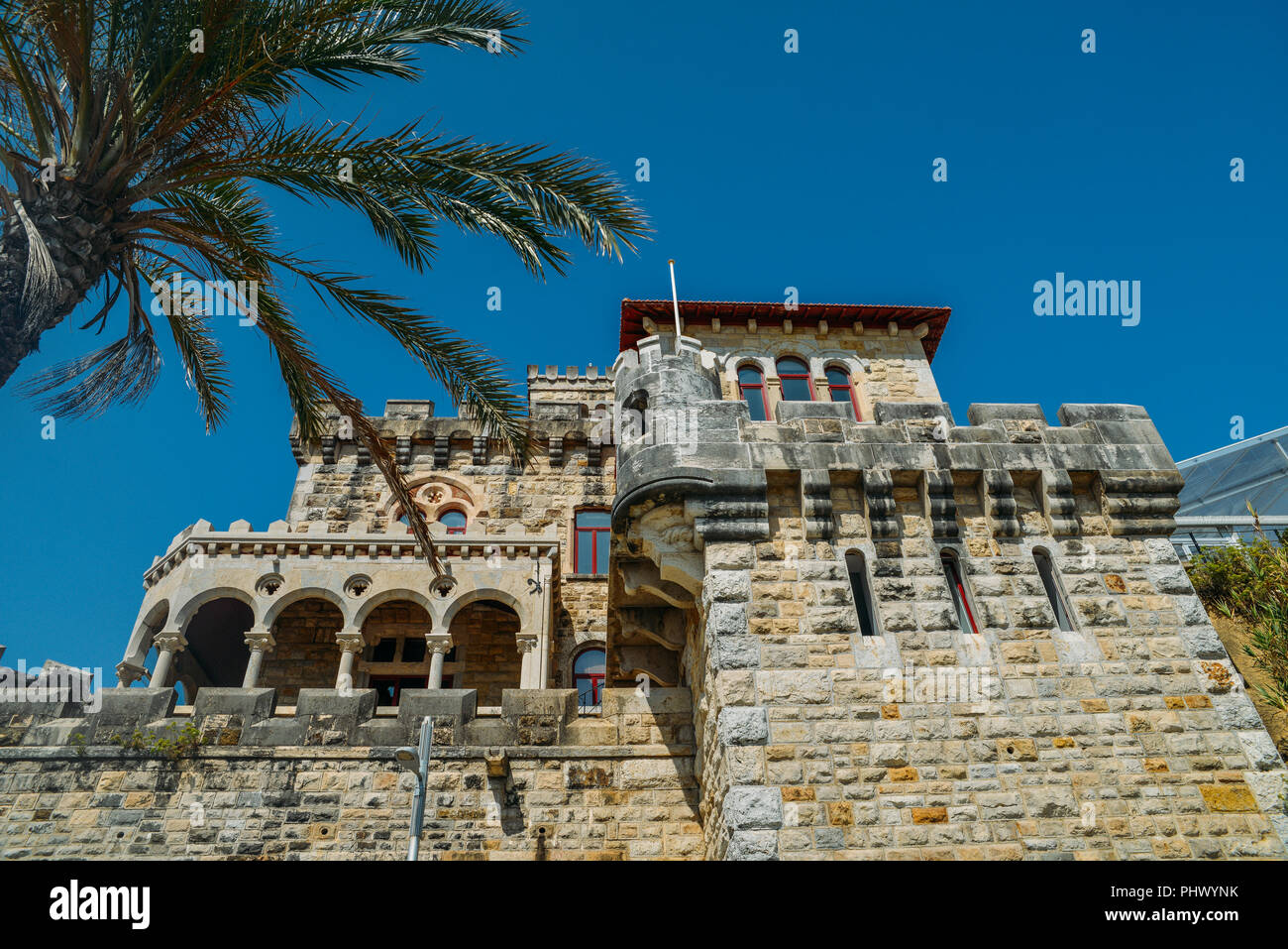 Estoril, Portugal - August 30th, 2018: Estoril on Lisbon's Sunshine coast - Historical fortified Baronial mansion overlooking the beach Stock Photo