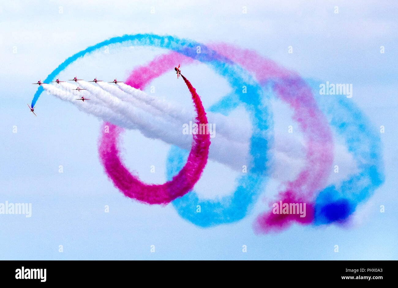 Red Arrows planes flying in tornado formation during a display at Bournemouth Air Festival Stock Photo