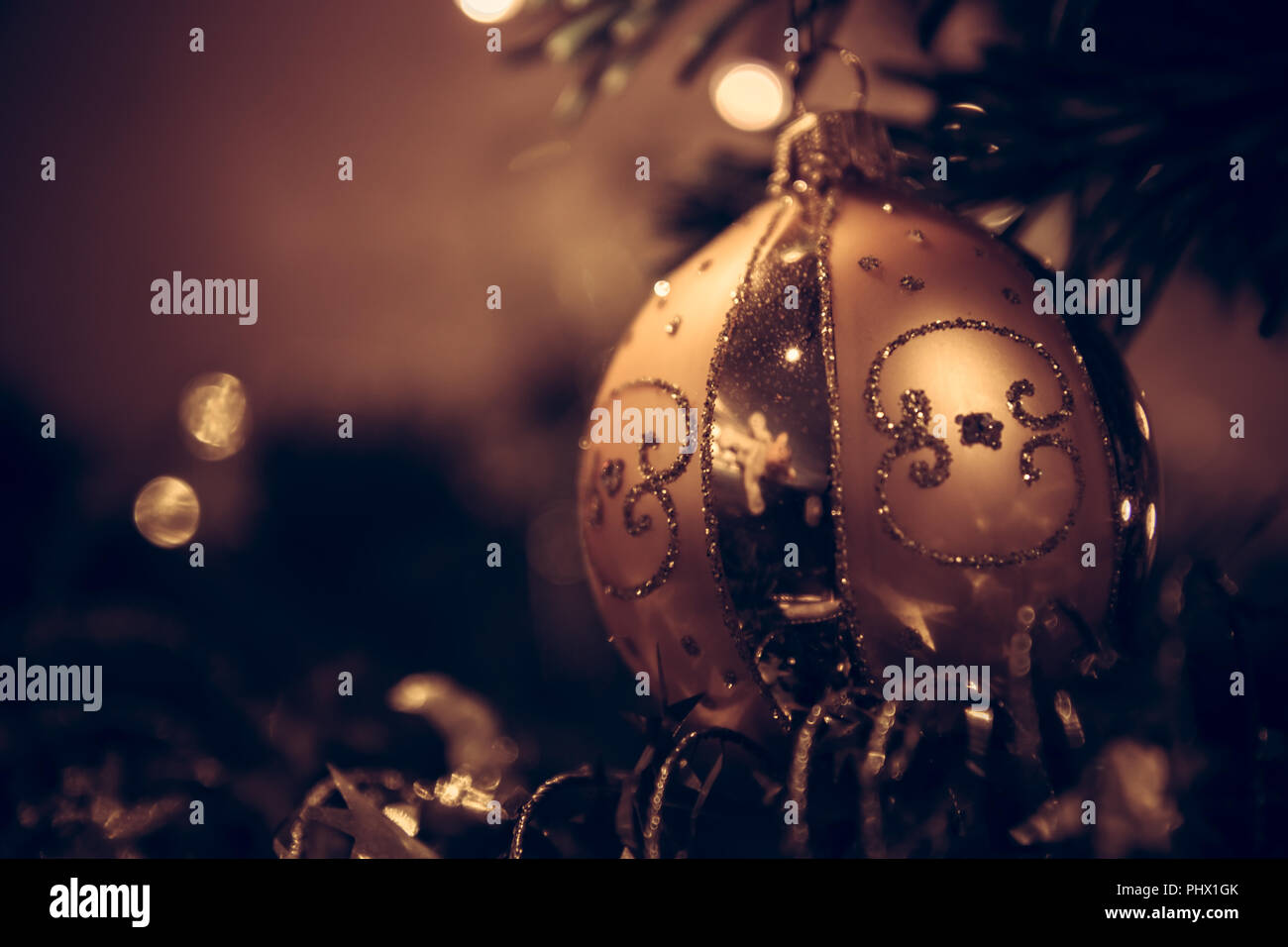 Vintage Christmas background with Christmas ball in dark golden colors Stock Photo