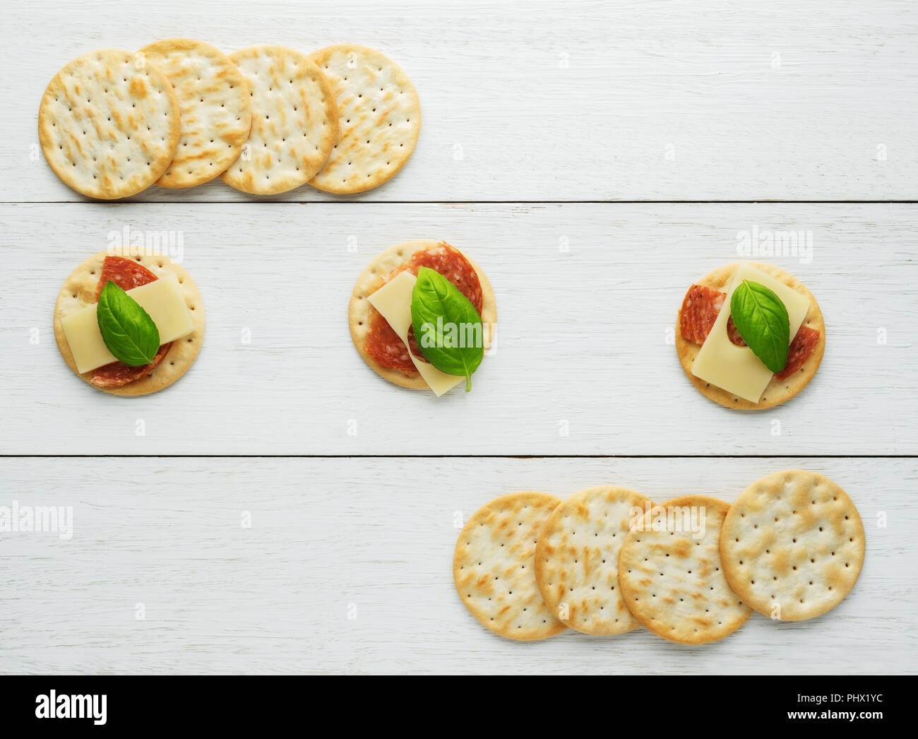 Crackers with cheese and salami Stock Photo Alamy