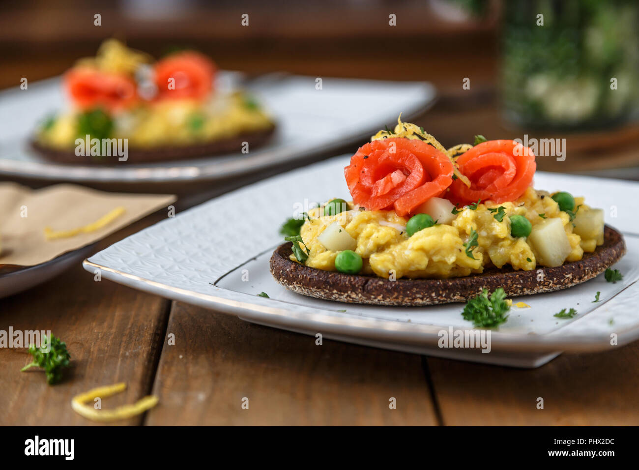 Smorrebrod with salmon and scramble egg on rye bread Stock Photo - Alamy