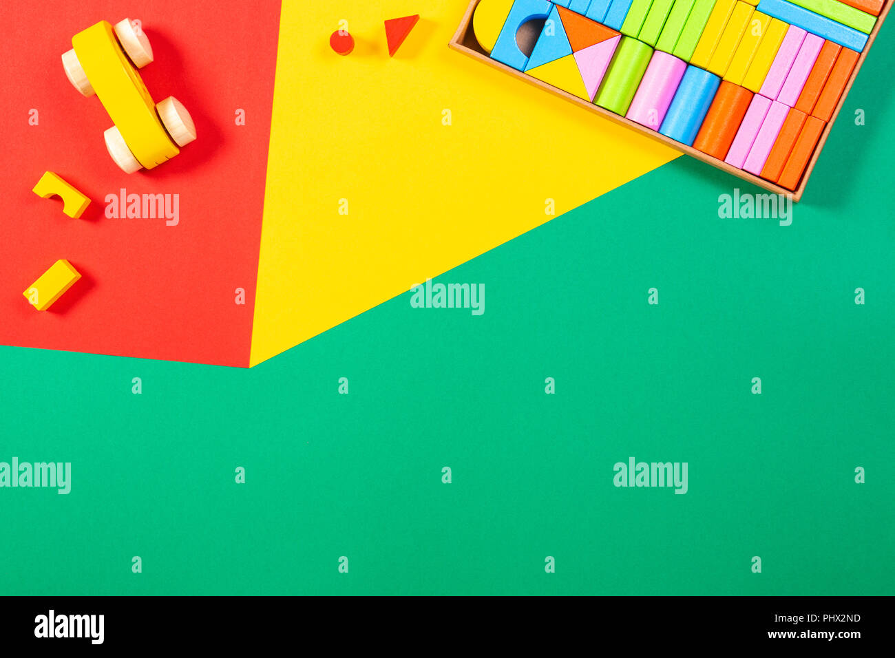 Toy car and wooden blocks on colorful background Stock Photo - Alamy