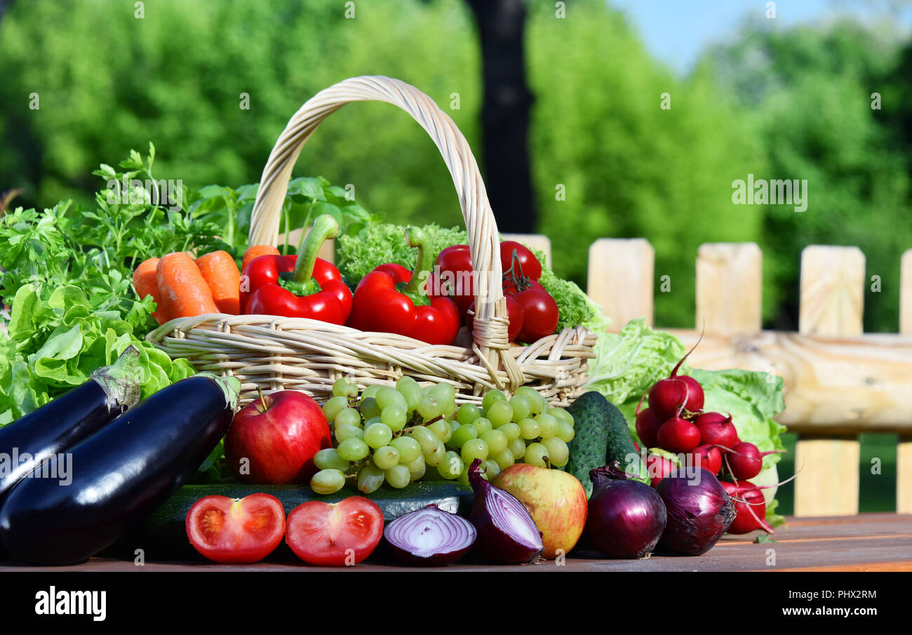 Variety of fresh organic vegetables in wicker basket Stock Photo - Alamy
