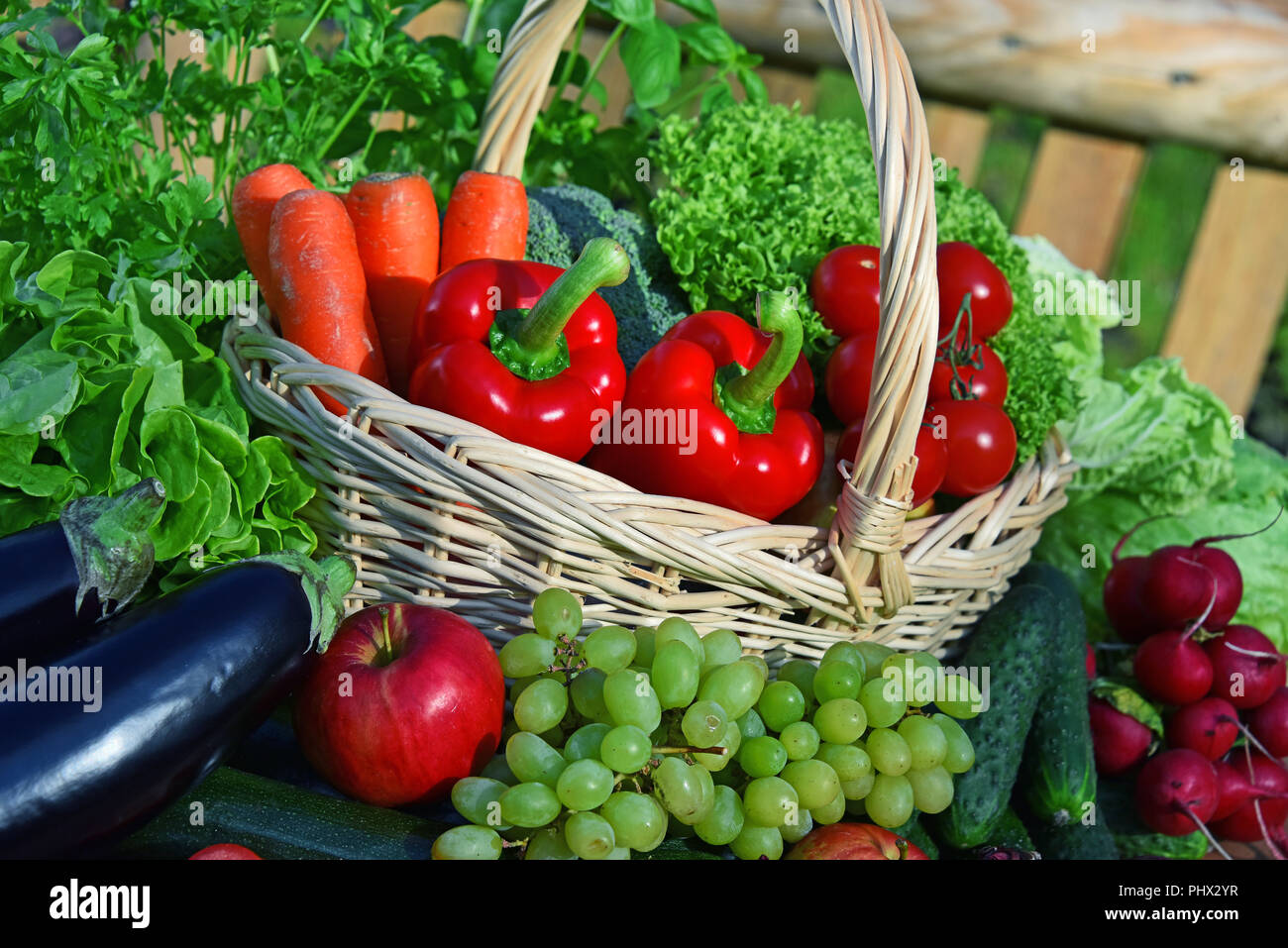 Variety of fresh organic vegetables in wicker basket Stock Photo - Alamy