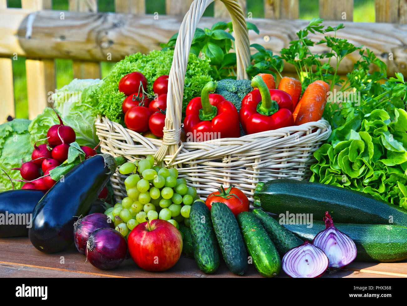 Variety of fresh organic vegetables in wicker basket Stock Photo - Alamy