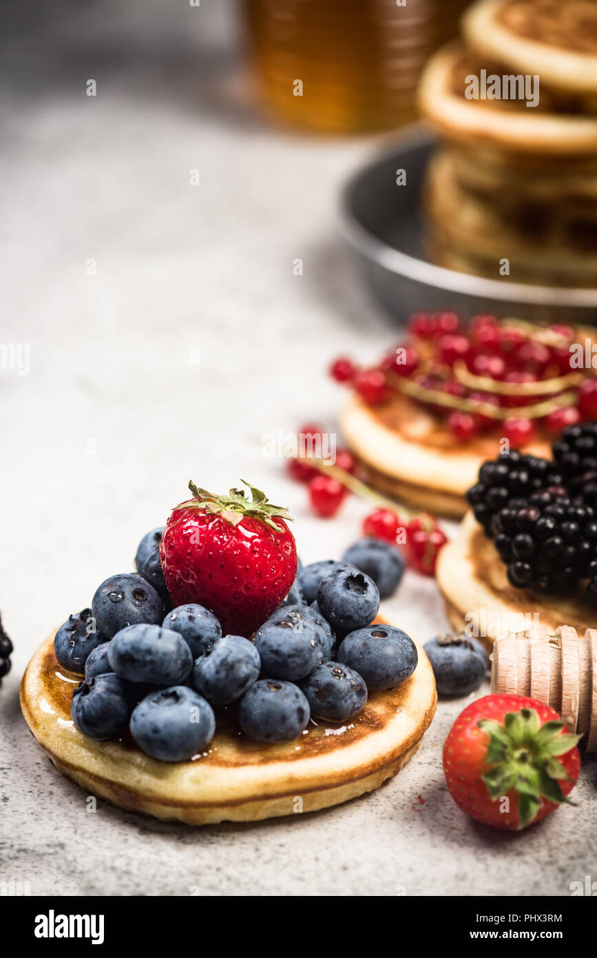 Pancakes with fruits, close up view. Stock Photo