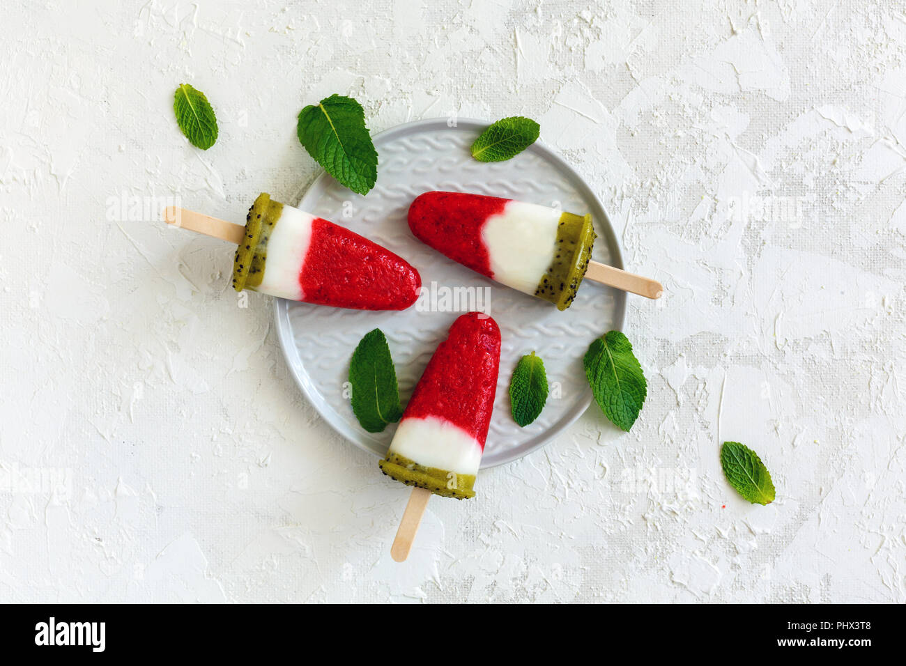 Yogurt popsicle with strawberries and kiwi Stock Photo Alamy