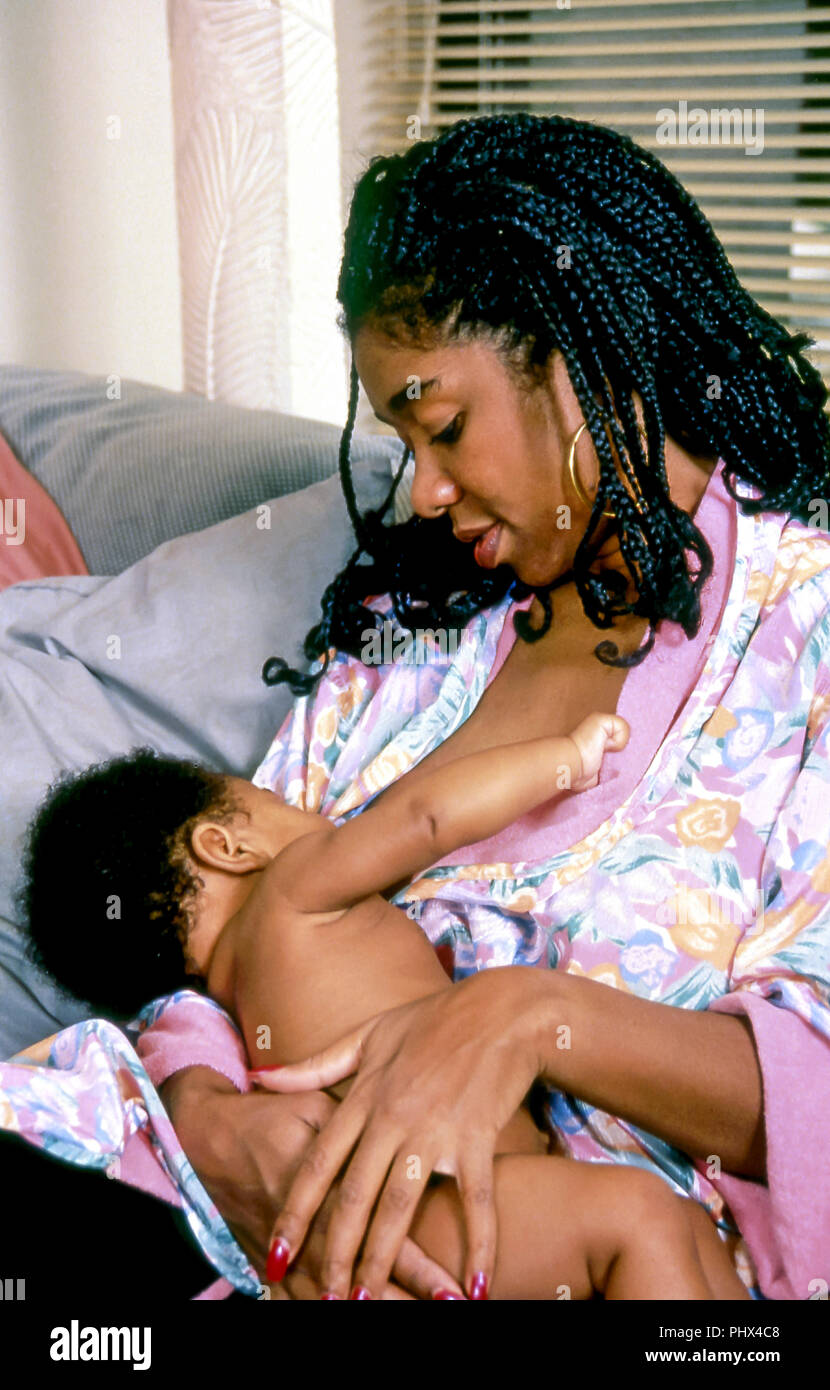 African American woman breast feeds her infant at home  MR.  © Myrleen Pearson  ..Ferguson Cate Stock Photo