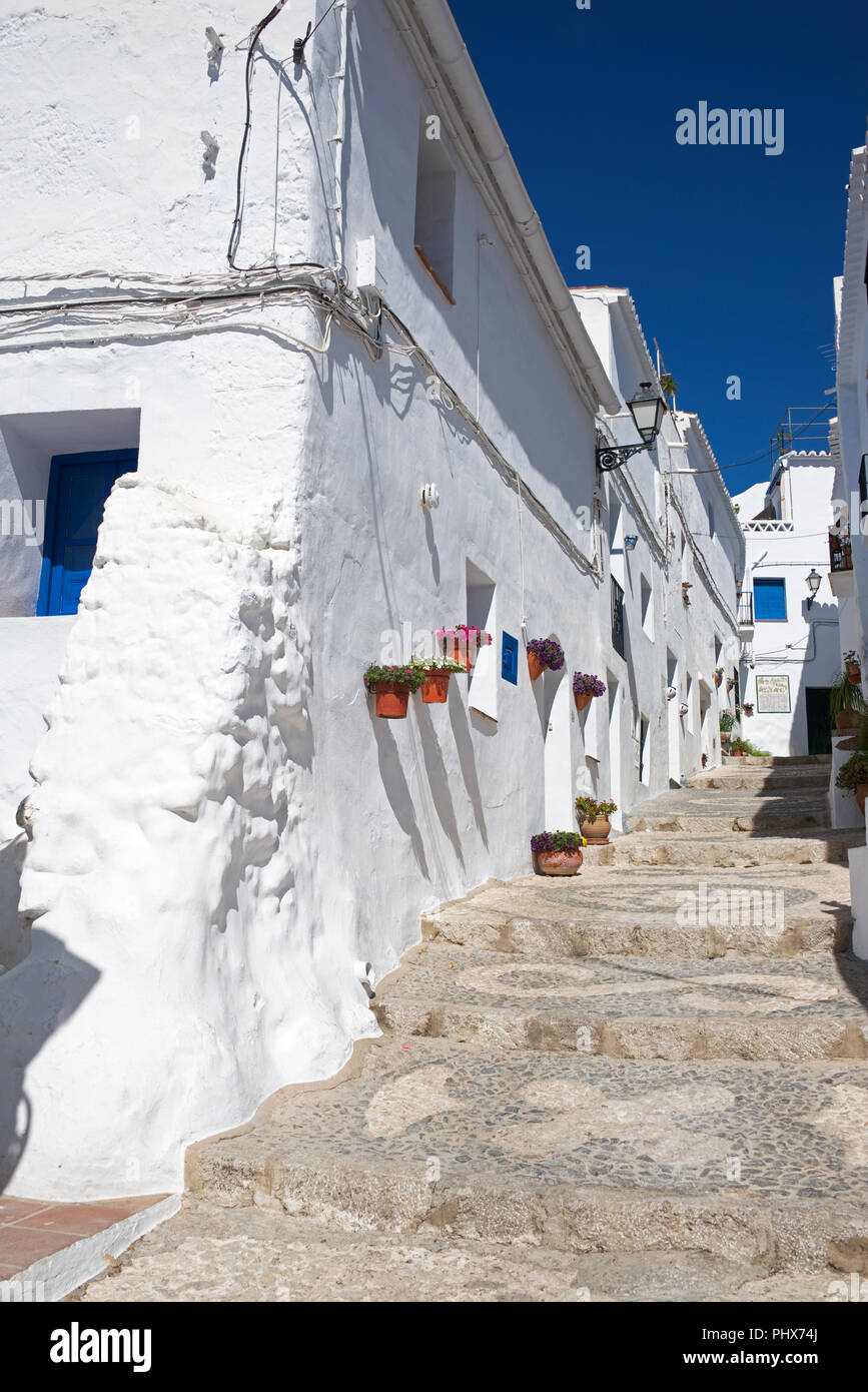 Whitewashed houses and steep footpath Frigiliana Costa Del Sol Andalucia Spain Stock Photo
