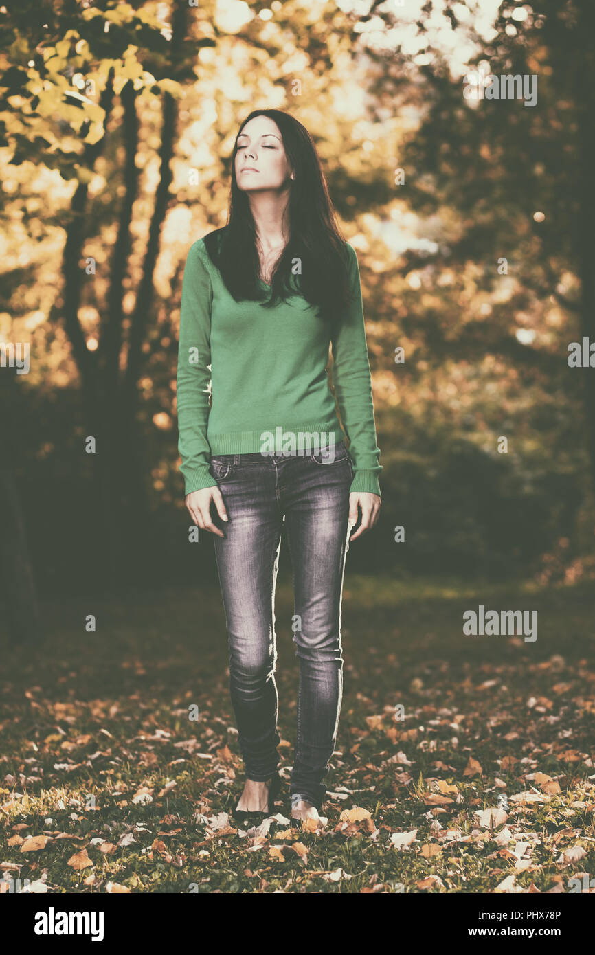 Walking happy woman thinking hi-res stock photography and images - Alamy