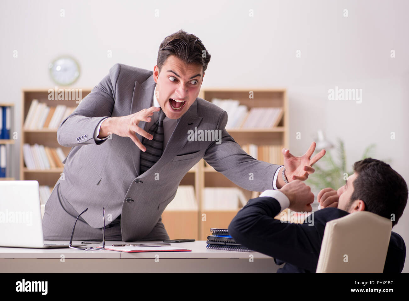 Angry boss shouting at his employee Stock Photo - Alamy