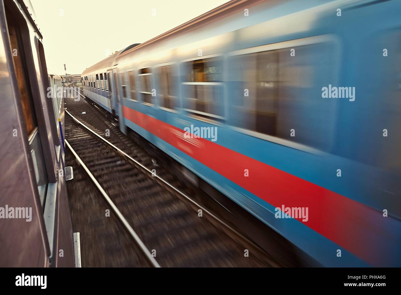 Long commuter train passing hi-res stock photography and images - Alamy