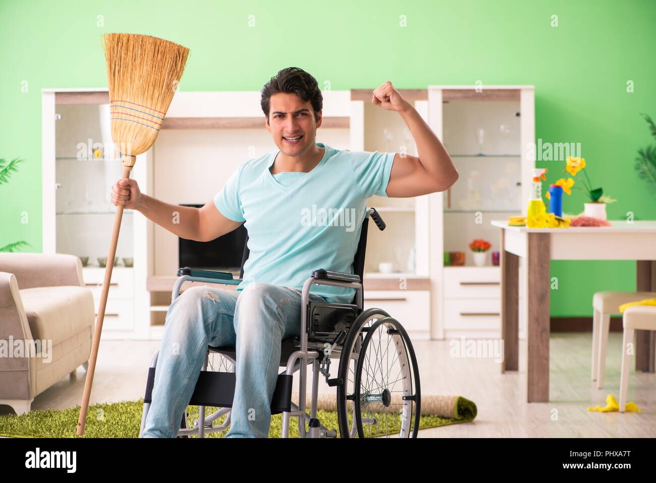 Disabled man on wheelchair cleaning house Stock Photo Alamy