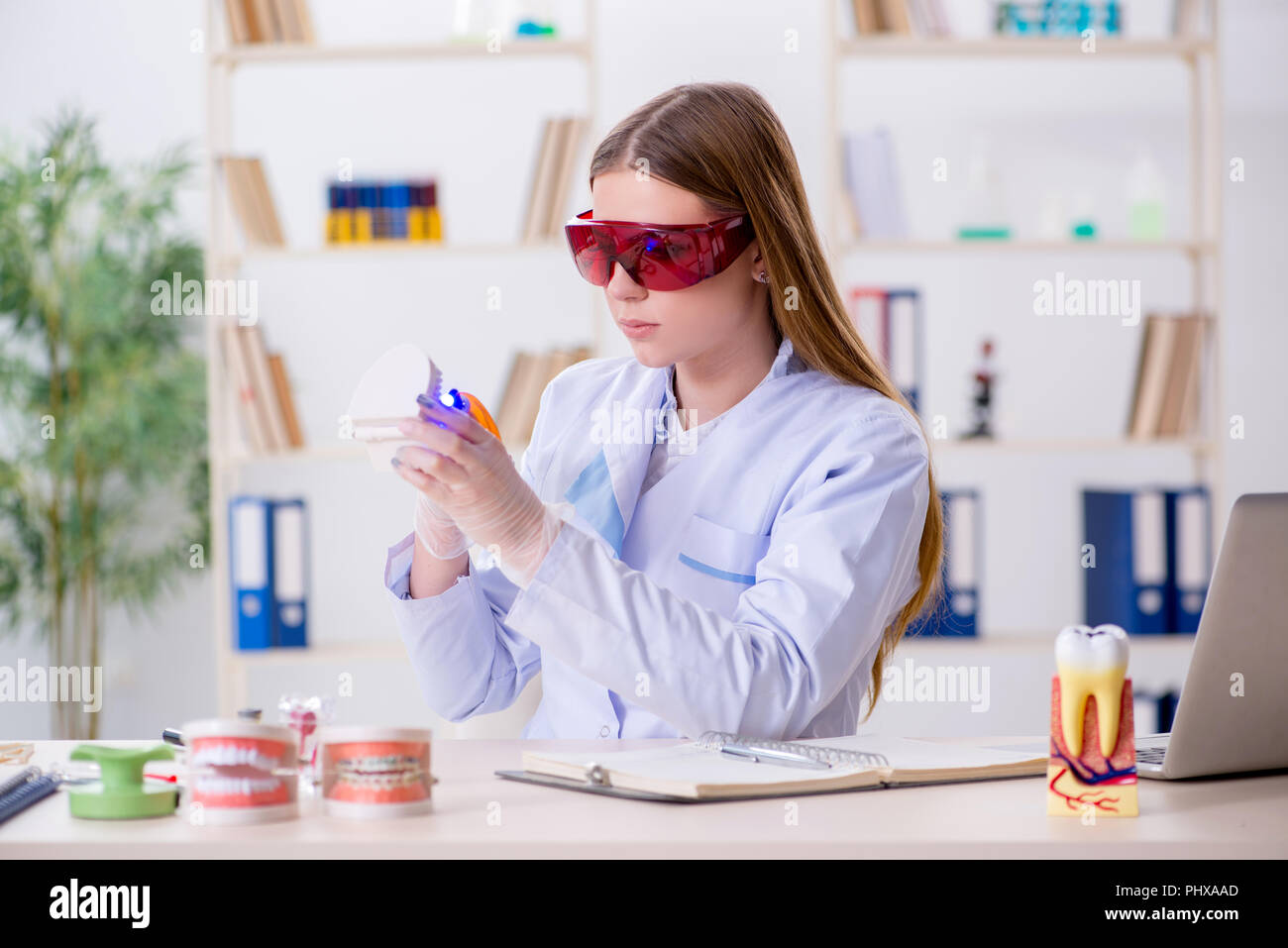Dentistry student practicing skills in classroom Stock Photo - Alamy