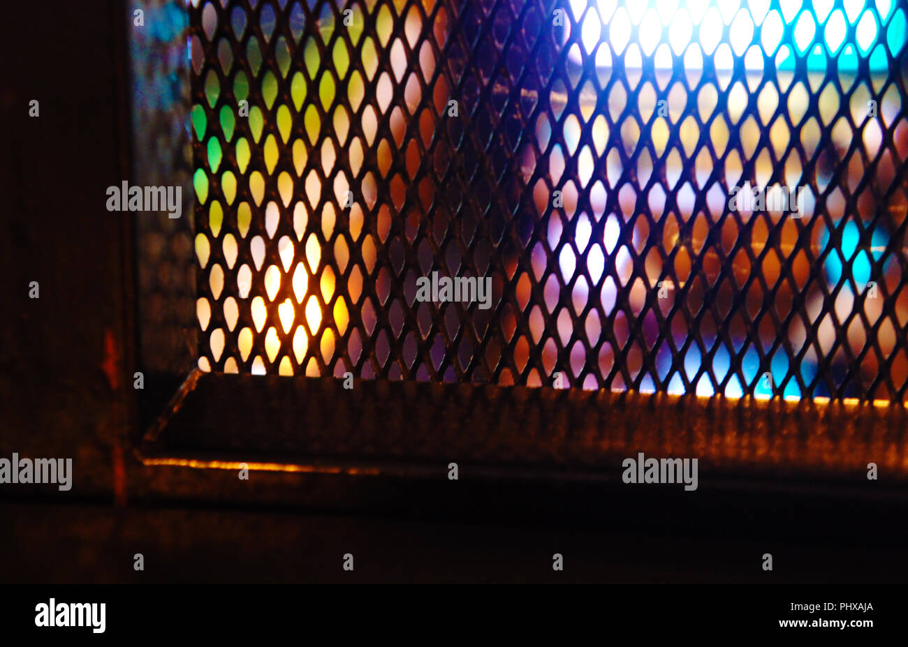 iron decorative mesh in the cafe. loft dyeing, city lights Stock Photo