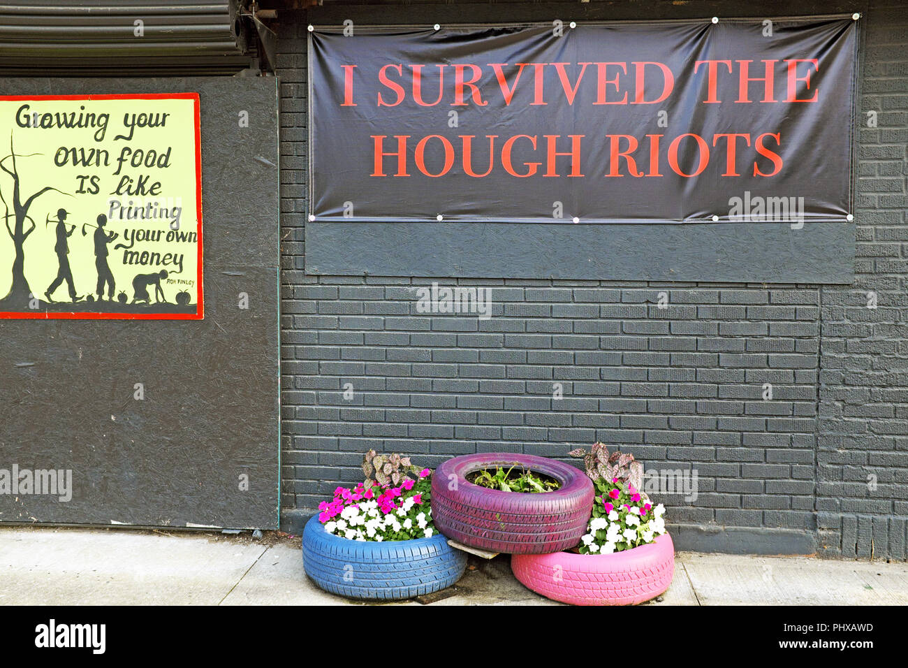 'I Survived The Hough Riots' banner on Hough Avenue in Cleveland, Ohio keeps the memory of the 1966 Hough Riots alive while reminding of progress made Stock Photo