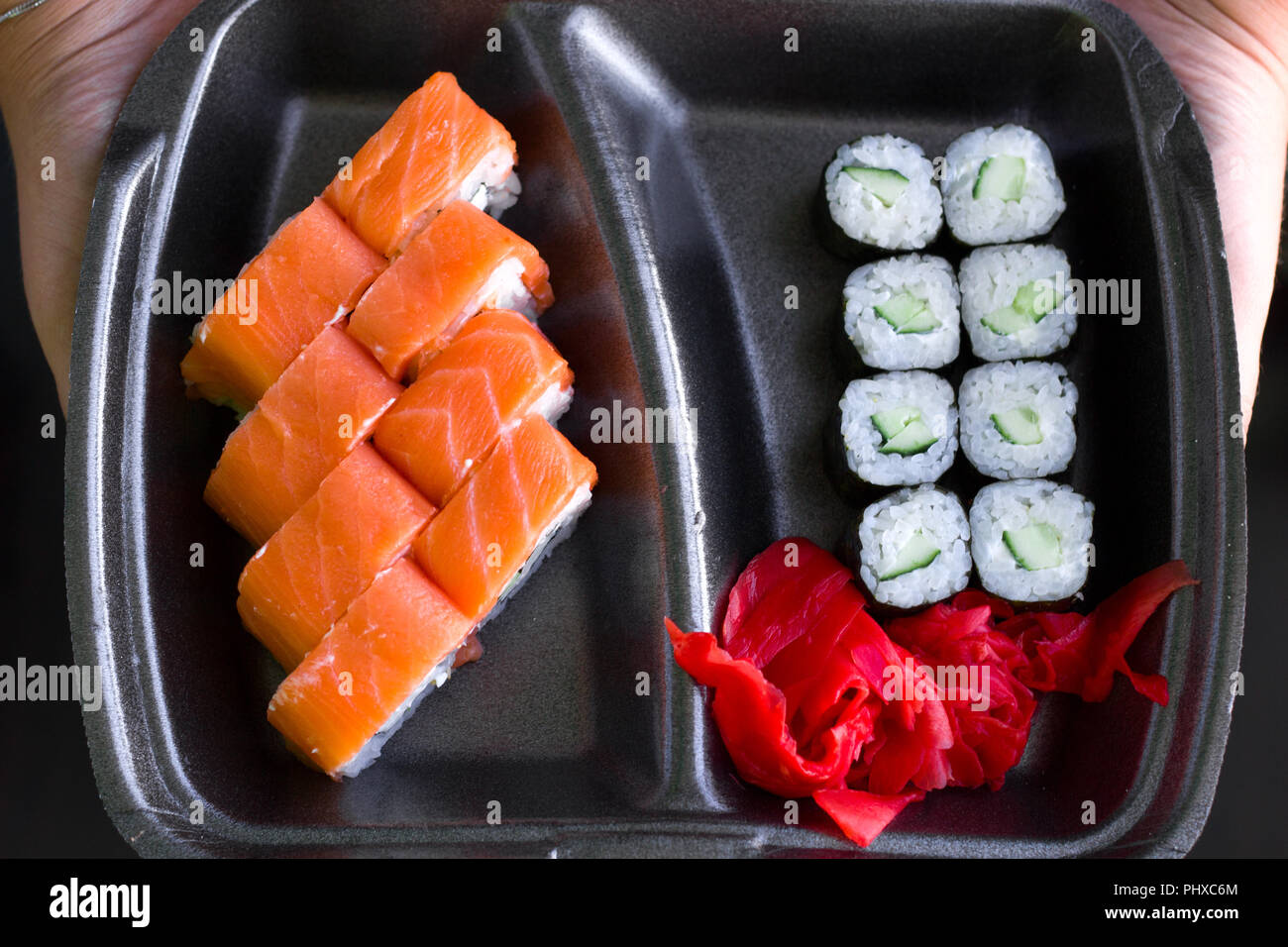Fresh Sushi On Black Plate Woman Holding Container With Sushi Sushi Delivery Asian Food Stock Photo Alamy