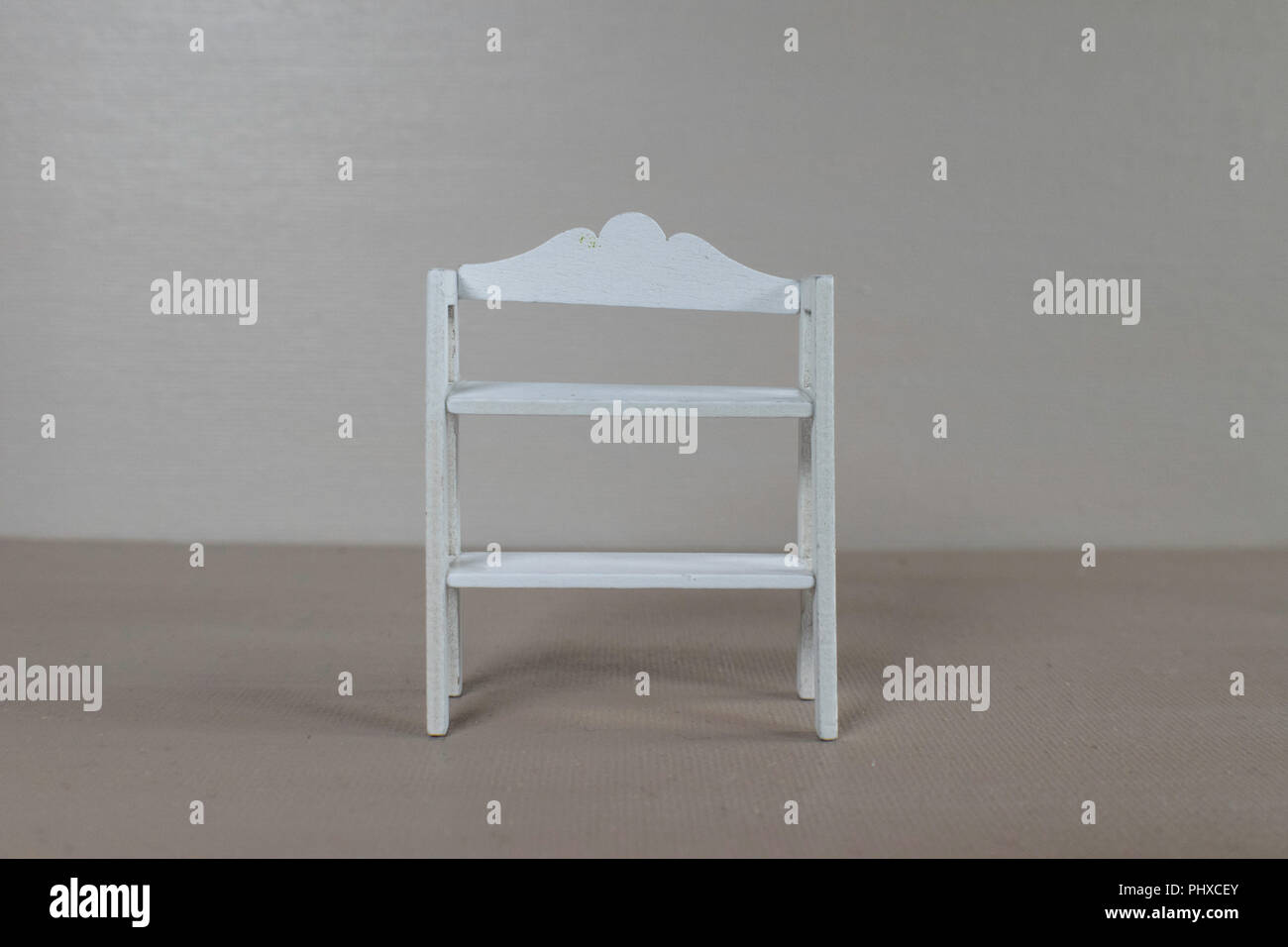 Handmade white wooden shelves with a brown background Stock Photo Alamy