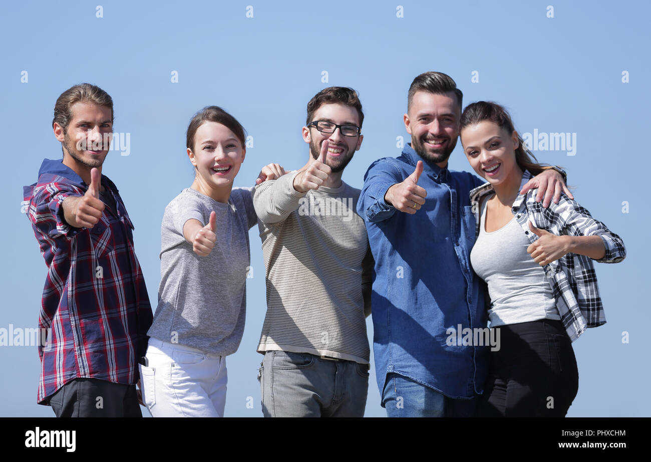 group of young people showing thumb up Stock Photo - Alamy