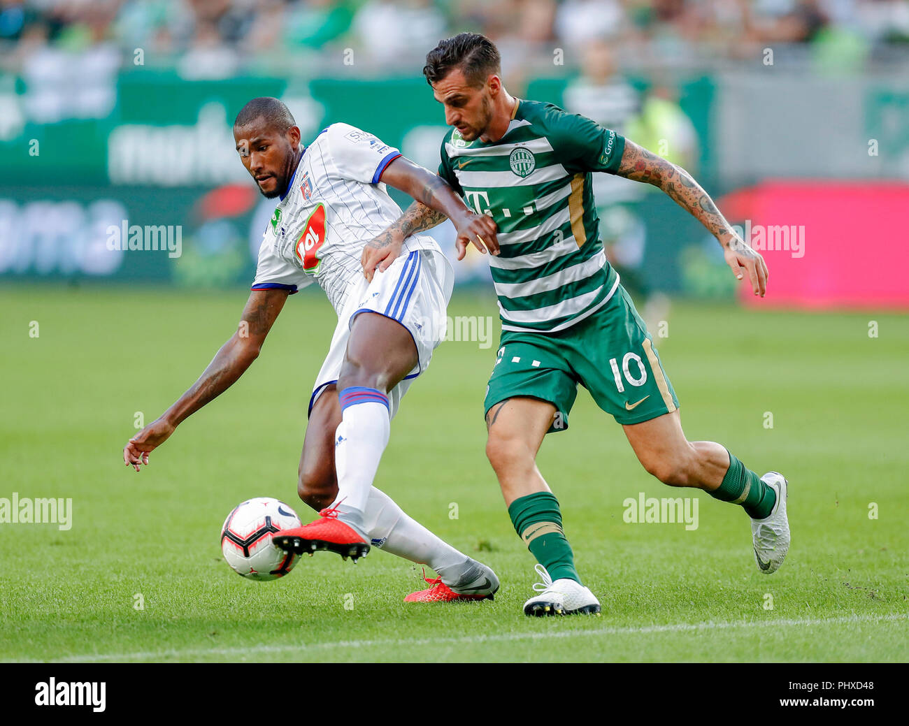 Budapest, Hungary. 2 September 2018. (l-r) Paulo Vinicius of MOL Vidi FC  competes for the ball with Davide Lanzafame of Ferencvarosi TC during the  Hungarian OTP Bank Liga match between Ferencvarosi TC