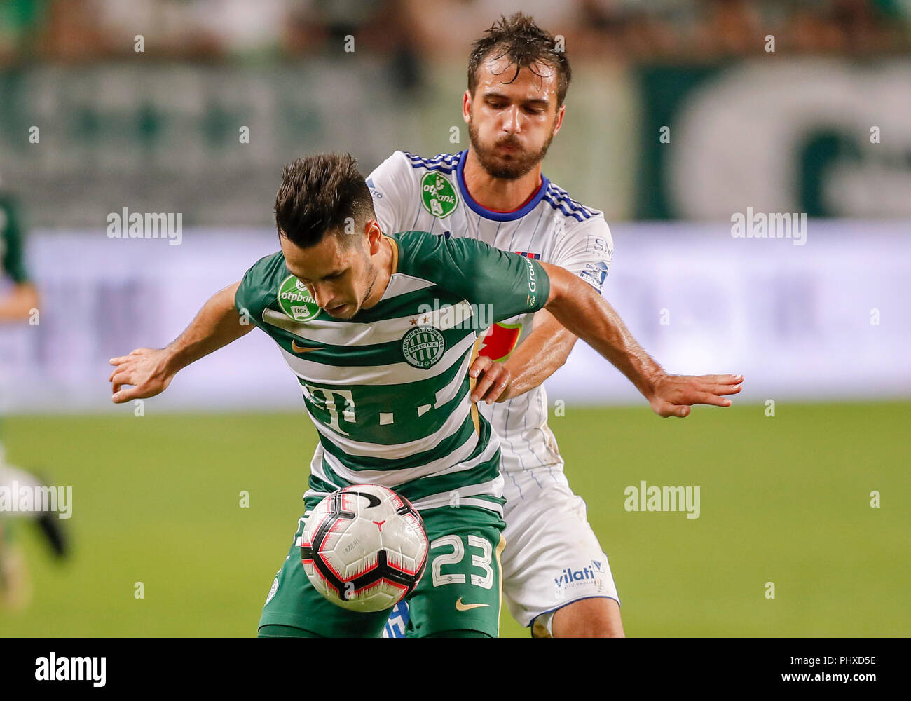 Budapest, Hungary. 2 September 2018. (l-r) Lukacs Bole of Ferencvarosi TC  covers the ball from Boban Nikolov of MOL Vidi FC during the Hungarian OTP  Bank Liga match between Ferencvarosi TC and