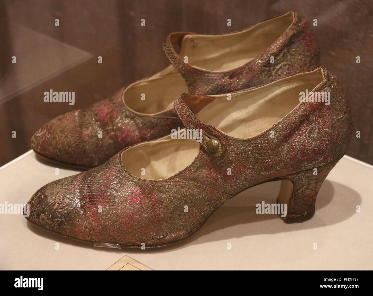New York City, New York, USA. 2nd Sep, 2018. Mary Jane shoes unidentified maker, ca.1926, made with silk and metallic patterned fabric, embossed metal buttons, seen in the exhibit 'Walk This Way' shoes from the Stuart Weitzman collection held at the New York Historical Society. Credit: Nancy Kaszerman/ZUMA Wire/Alamy Live News Stock Photo