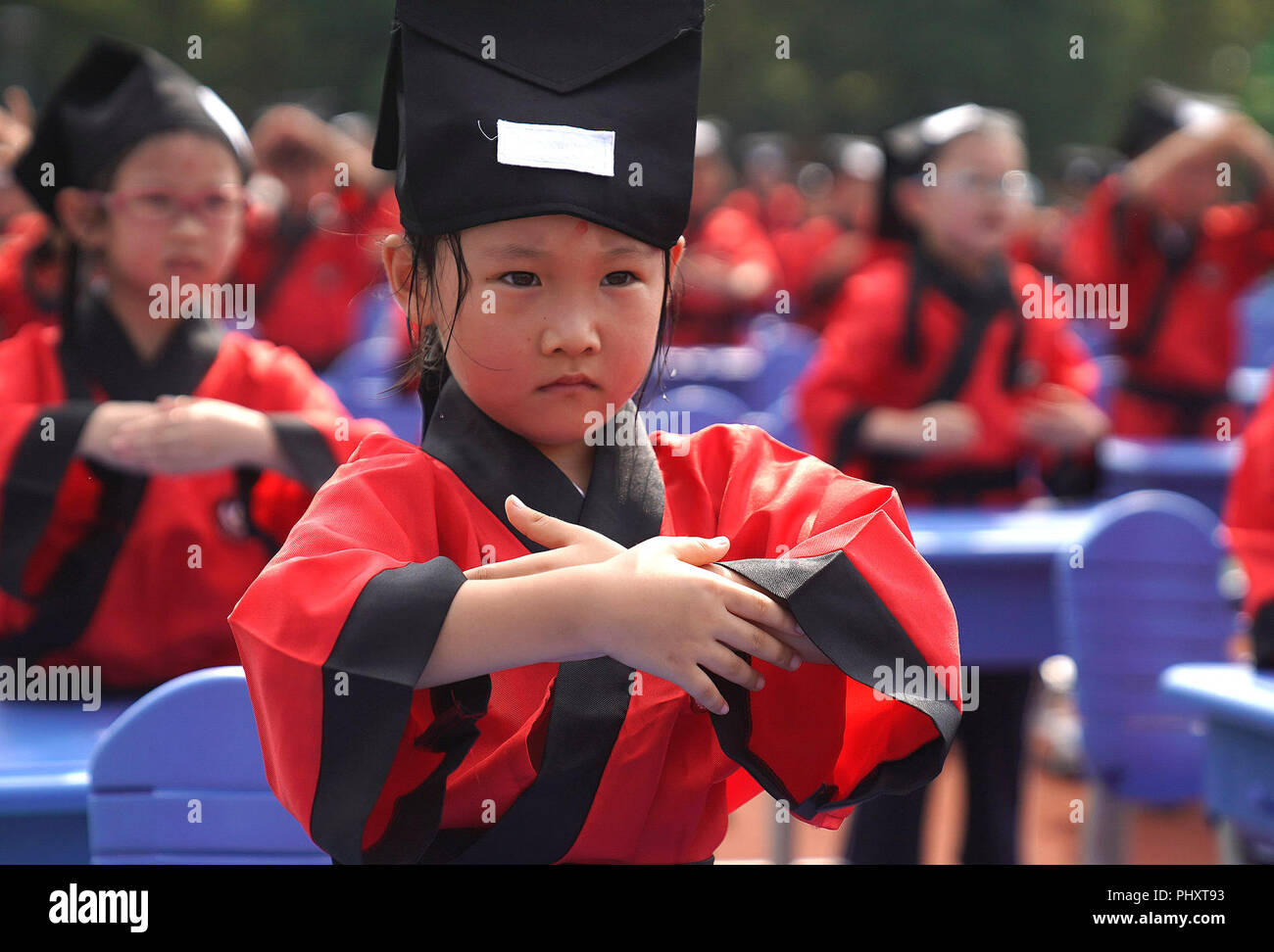 Shanghai, China. 3rd Sep, 2018. Students engage in an activity to pay respects to teachers at a school in Shanghai, east China, Sept. 3, 2018. Schools all over the country prepare various activities for students to greet the new semester. Credit: Chen Fei/Xinhua/Alamy Live News Stock Photo
